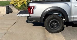 Silver truck backed into a driveway