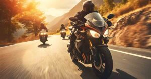 Group of motorcycle riders riding together at sunset in a staggered position.