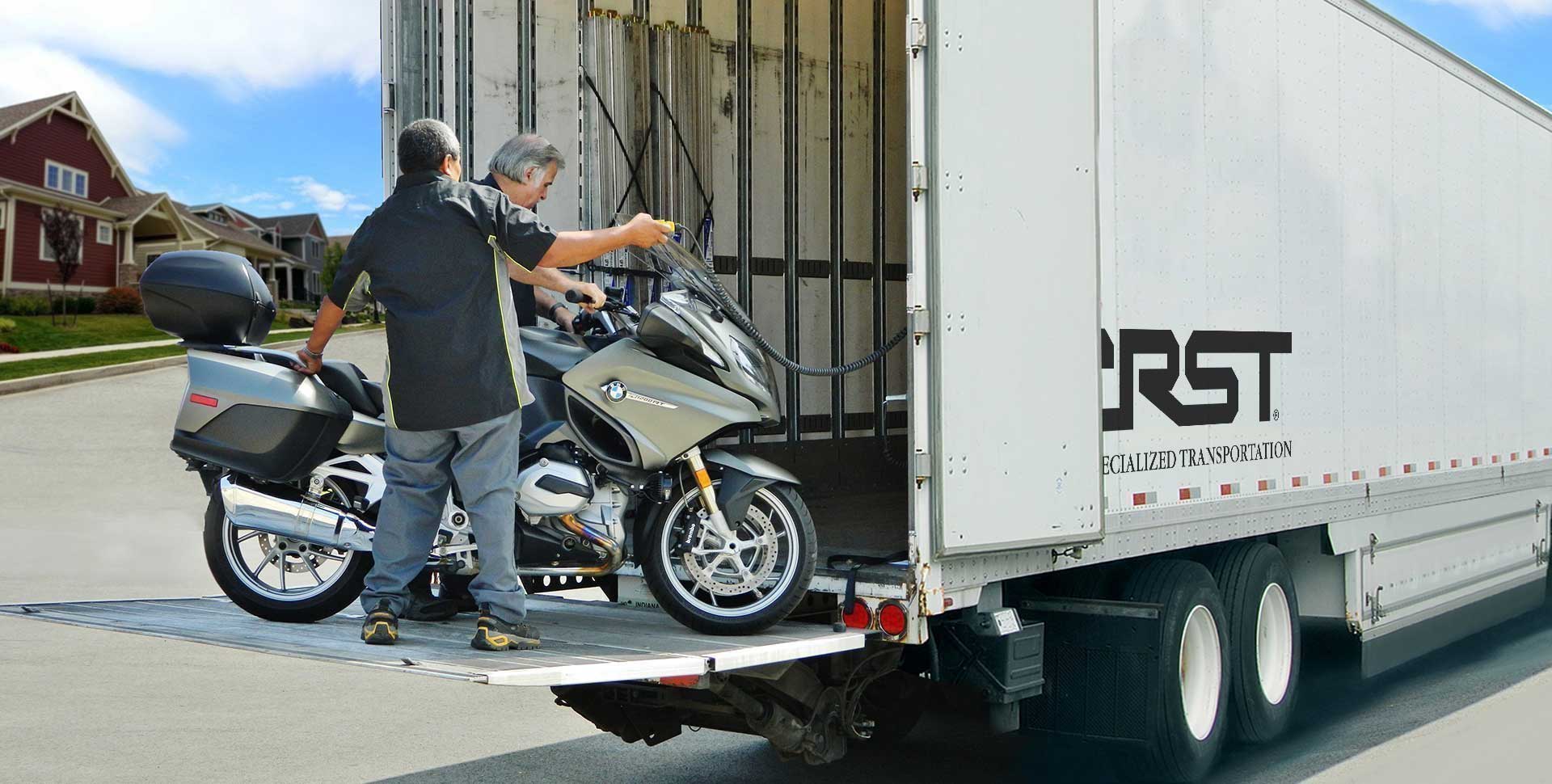 loading bike on a liftgate in a residential neighborhood