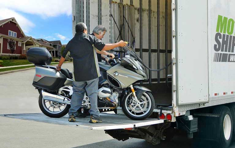 Loading a motorcycle on a liftgate in a residential neighborhood