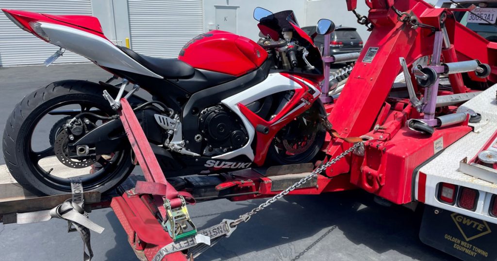 Motorcycle loaded on tow truck