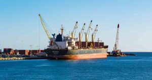 Cargo ship delivering motorcycle in Port of Honolulu.